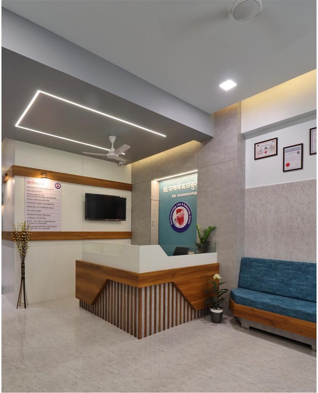Front desk and services board listing gastroscopy, colonoscopy and ERCP at the clinic in Solapur